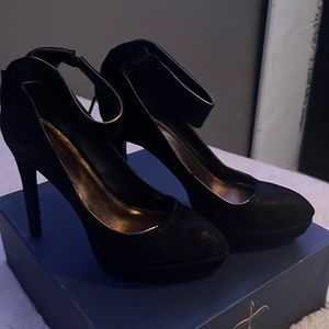 Black high heels. Used once. right shoe has a little scratch on the in side..
